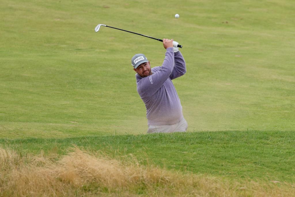 Thriston Lawrence of South Africa plays his second shot on the 18th hole during day four of The 152nd Open championship at Royal Troon on July 21, 2024.