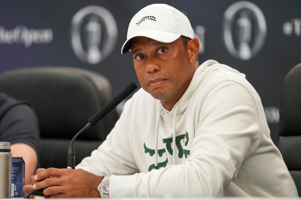 Tiger Woods speaks to reporters at the British Open on Tuesday.