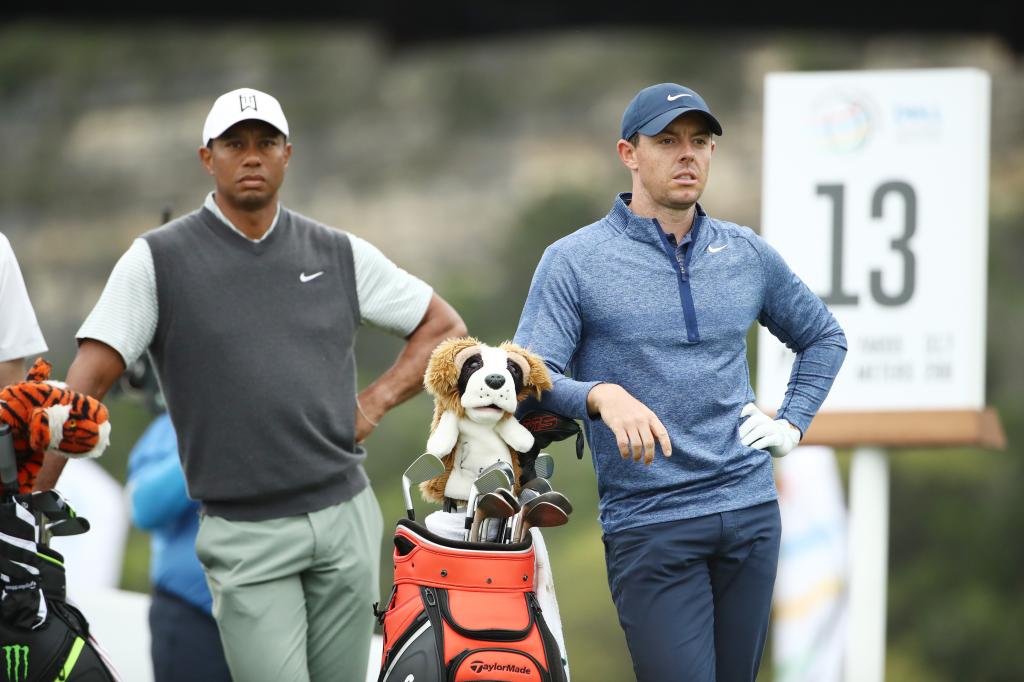 Tiger Woods and Rory McIlroy of Northern Ireland stand on the 13th tee during the fourth round of the World Golf Championships-Dell Technologies Match Play at Austin Country Club on March 30, 2019 in Austin, Texas.  