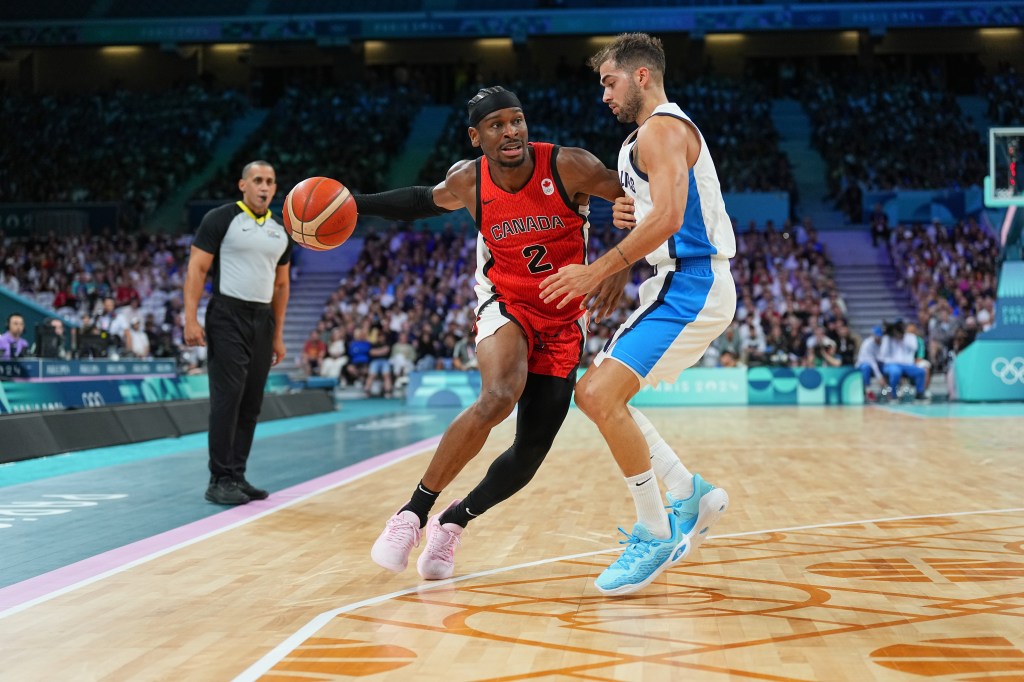 Shai Gilgeous-Alexander #2 of the Canadian Mens National Team goes to the basket during the game at the  Stade Pierre Mauroy on July 27, 2024 in Paris, France.
