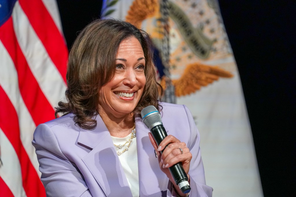 Kamala Harris holding a mic