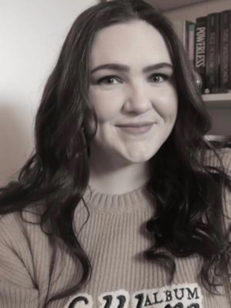 A woman smiling at the camera, Jo Danvers, who shared her strange dental experience on social media