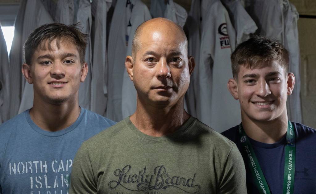 The Yonezuka family, consisting of Nick Jr., Nick Sr., and Jack, practicing Judo at their home in West Long Branch