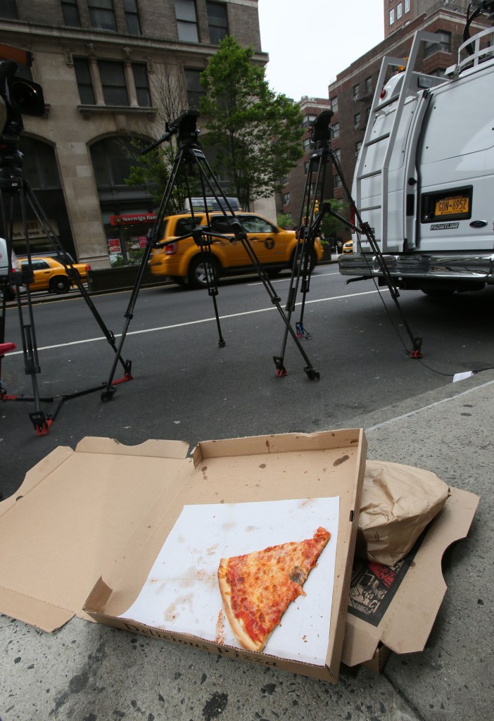 Showing Pizza boxes that had been delivered by the Flag of Anthony Weiner for the Media that camped outside former Congressman Anthony Weiner's Apartmentbuilding at 254 Park Avenue south in Manhattan, NY.