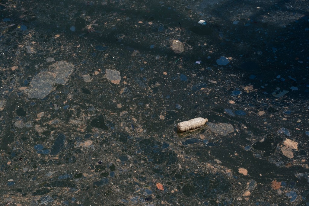 A water bottle on the polluted Gowanus Canal.