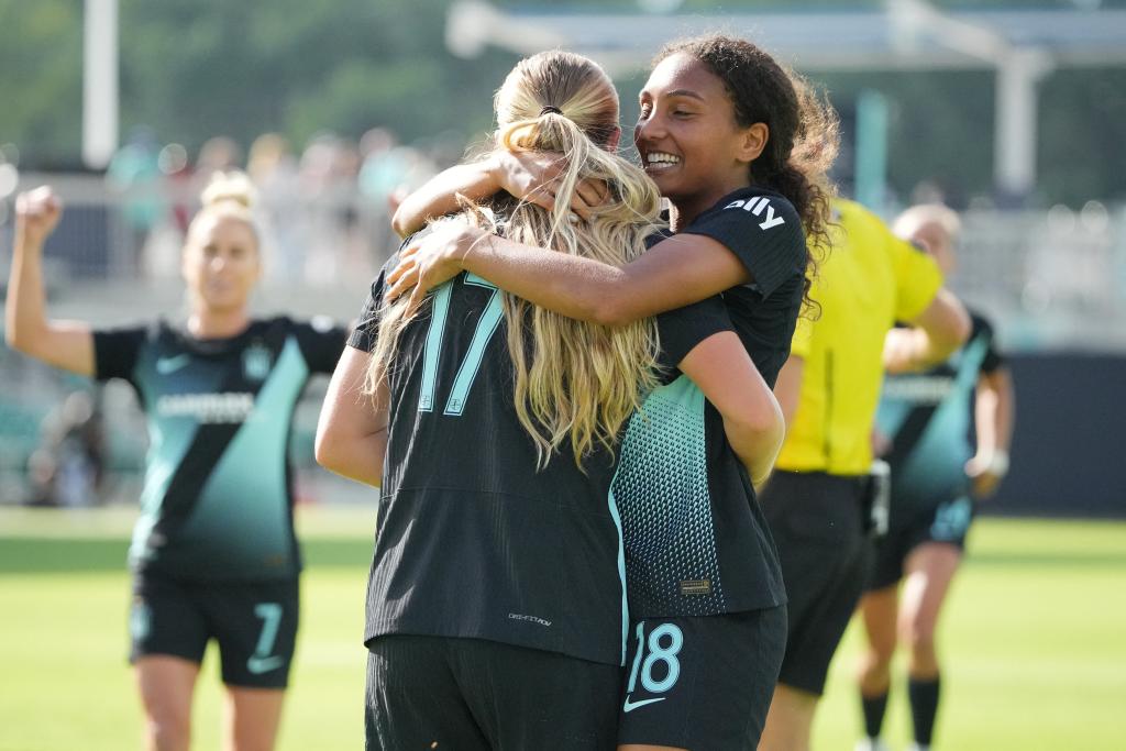 NJ/NY Gotham FC midfielders Delanie Sheehan and Yazmeen Ryan celebrating a goal during a soccer match against Angel City FC