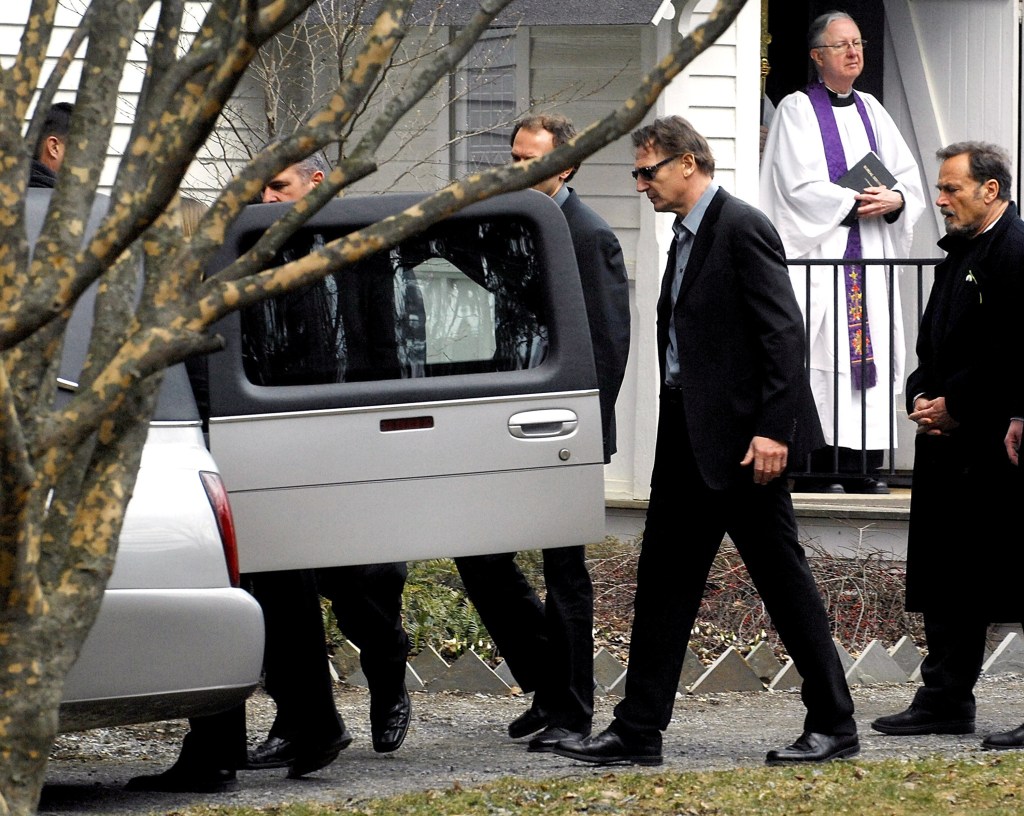 Pallbearers including actor Liam Neeson.