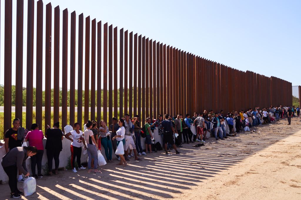 Migrants are processed by U.S. Customs and Border Protection officers after crossing the United States-Mexico border on Thursday, July 14, 2022 in Eagle Pass, Texas