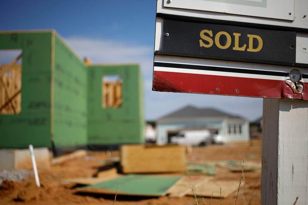 A "Sold" sign at a house under construction in Louisville.