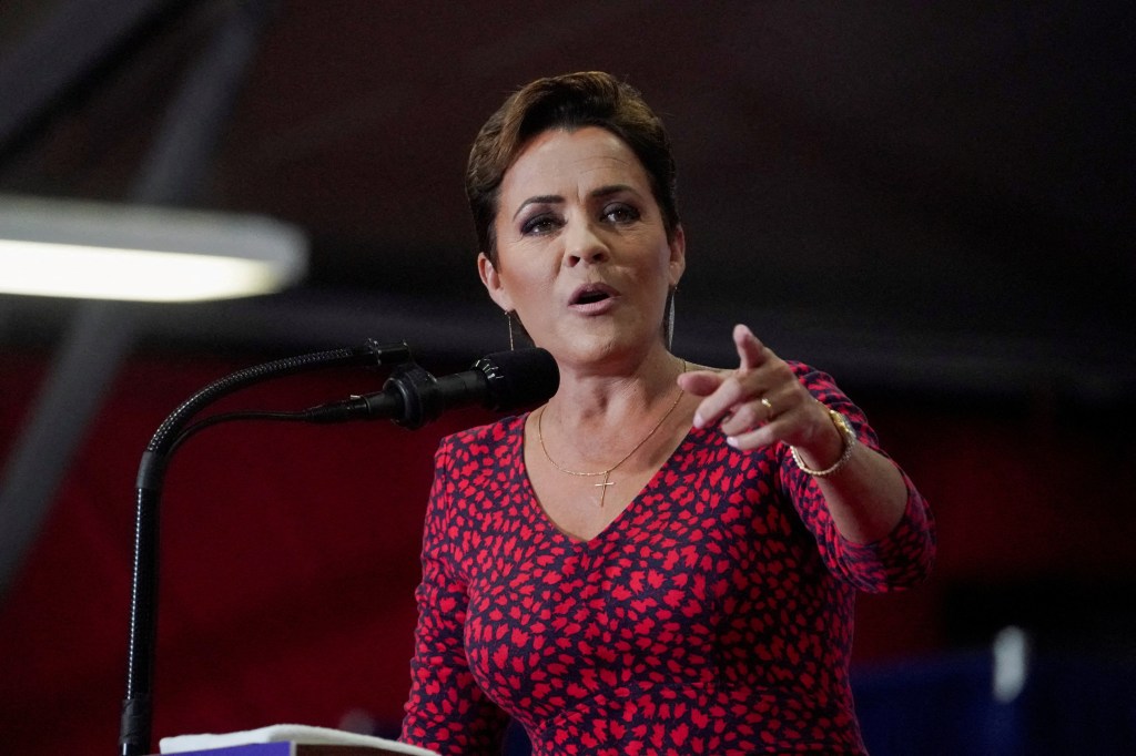 Arizona Republican U.S. Senate candidate Kari Lake speaking into a microphone at a rally held by Senator JD Vance in Glendale, Arizona on July 31, 2024.