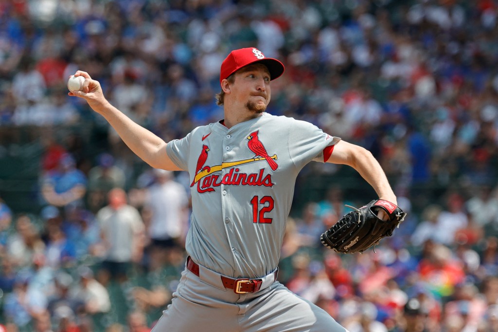 St. Louis Cardinals starting pitcher Erick Fedde (12) delivers against the Chicago Cubs during the first inning at Wrigley Field. 