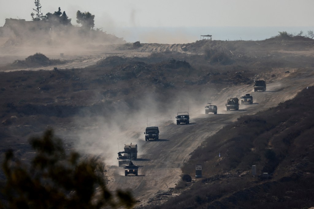 An Israeli military convoy moves inside the Gaza Strip, amid the ongoing conflict between Israel and Hamas, as seen from Israel, August 14, 2024.