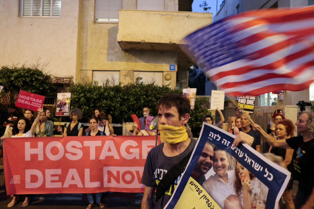 Supporters of hostages who were kidnapped during the deadly October 7 attack, demand their immediate release, during a protest outside a press event attended by U.S. Secretary of State Blinken, in Tel Aviv, Israel, August 19, 2024. 