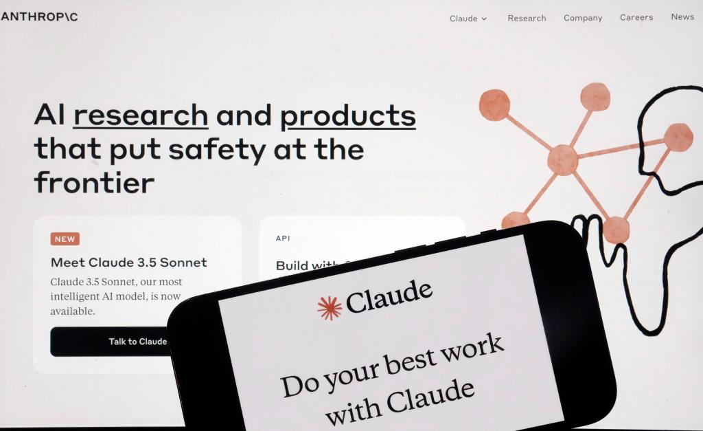 Anthropic website and mobile app displayed on a computer screen, under scrutiny by Britain's competition watchdog for partnership with Google.