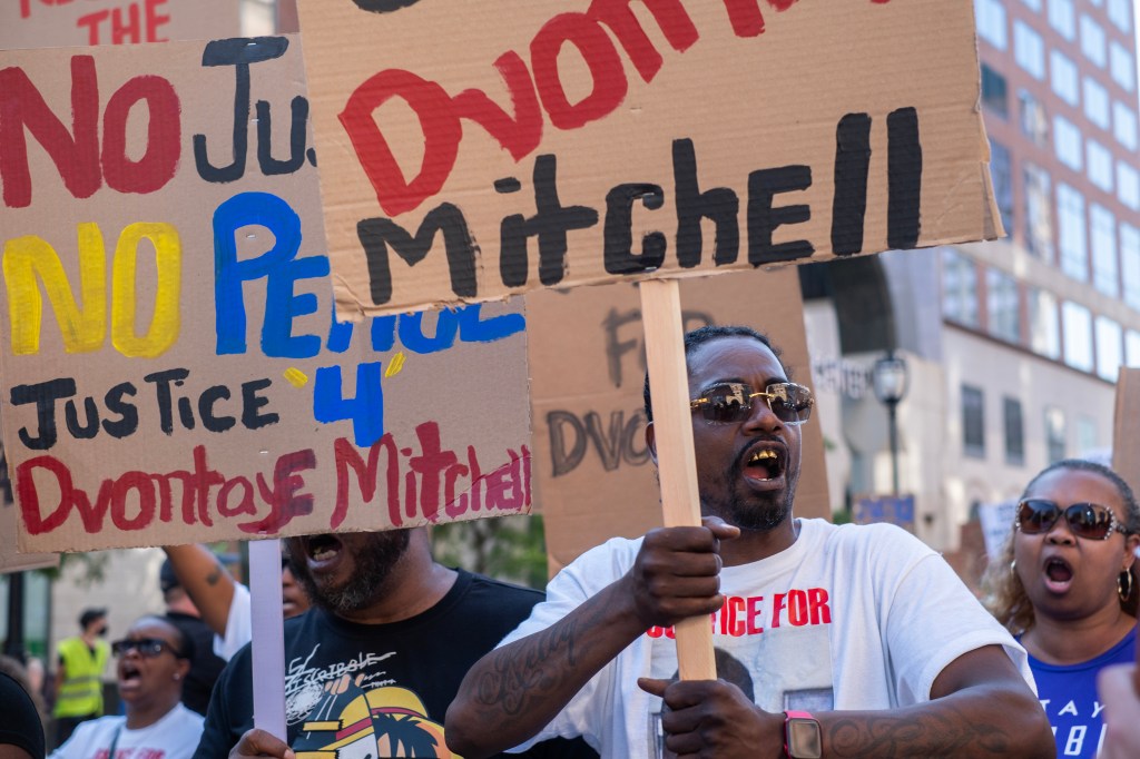 Protesters call for justice for D'Vontaye Mitchell and Samuel Sharpe during a march through the streets as the RNC continues on July 18, 2024 in Milwaukee, Wisconsin.