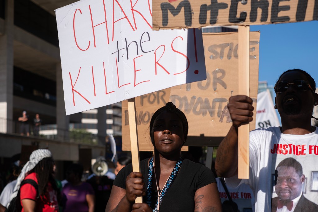 Protesters call for justice for D'Vontaye Mitchell and Samuel Sharpe during a march through the streets as the RNC continues on July 18, 2024 in Milwaukee, Wisconsin.