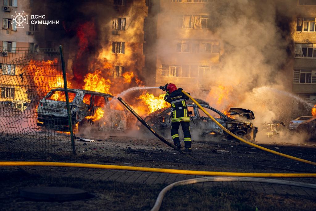 A firefighter works at a site of a Russian missile strike, amid Russia's attack on Ukraine in Sumy on August 17.