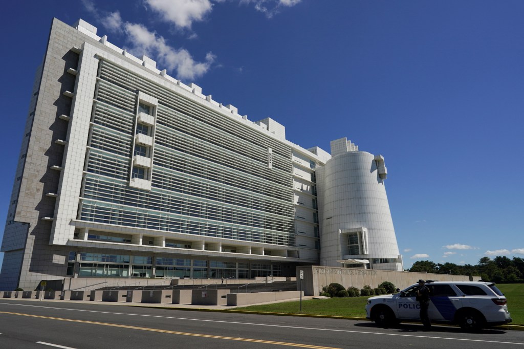 Police car parked outside Alfonse M. D'Amato U.S. Courthouse in Central Islip, New York, with George Santos appearing in court