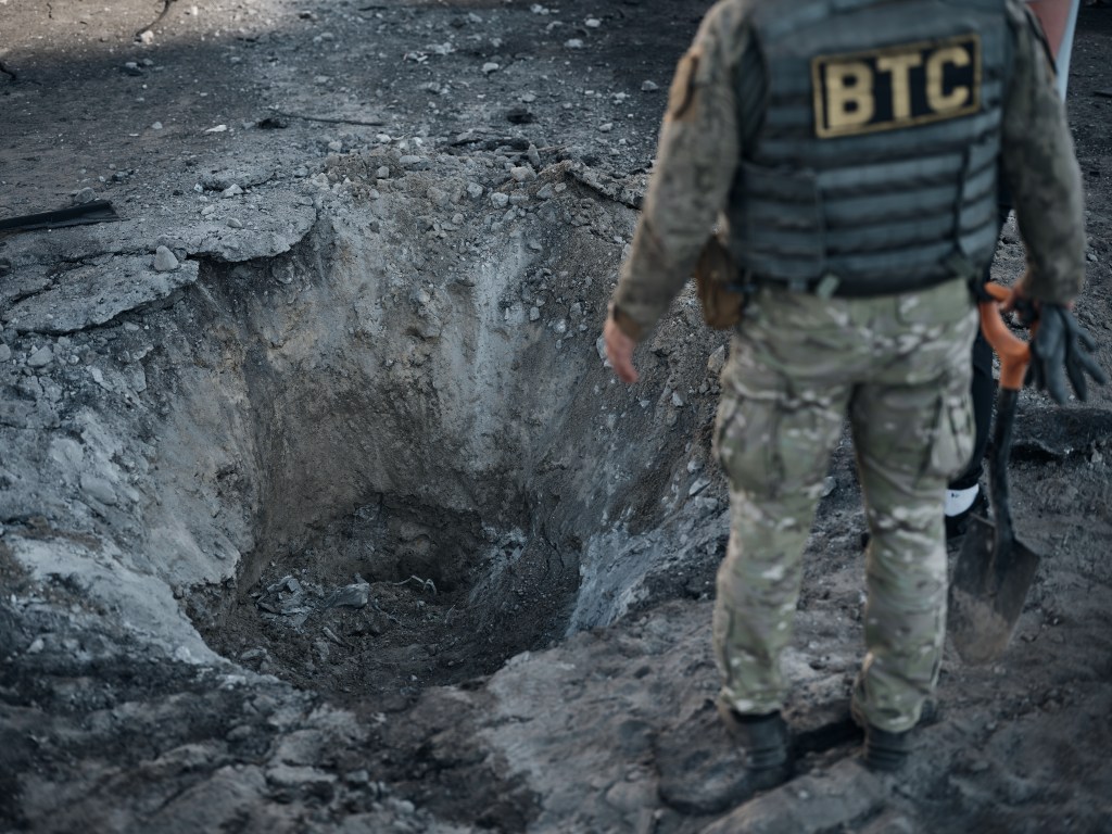 A crater is seen in the aftermath of a Russian missile strike on a residential area of Ukraine on August 17.