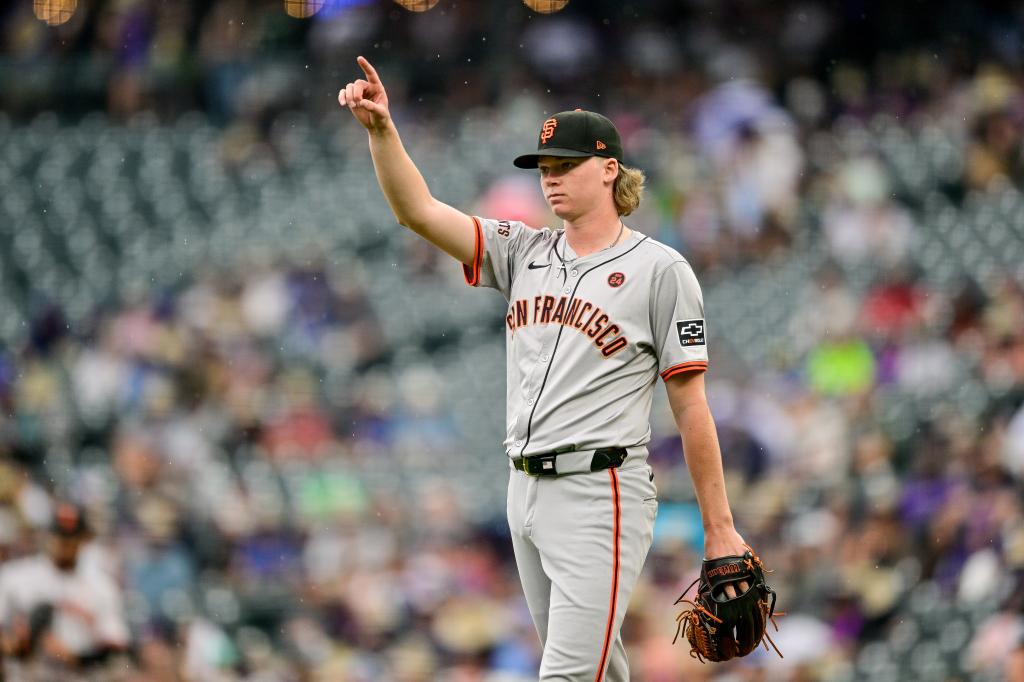 Hayden Birdsong #60 of the San Francisco Giants points to the outfield to celebrate a defensive play in the third inning against the Colorado Rockies at Coors Field on July 21, 2024 in Denver, Colorado.