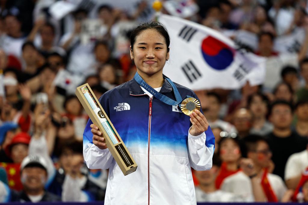 South Korean gold medallist An Se-young posing with her medal on the podium at the women's singles badminton medal ceremony during the Paris 2024 Olympic Games