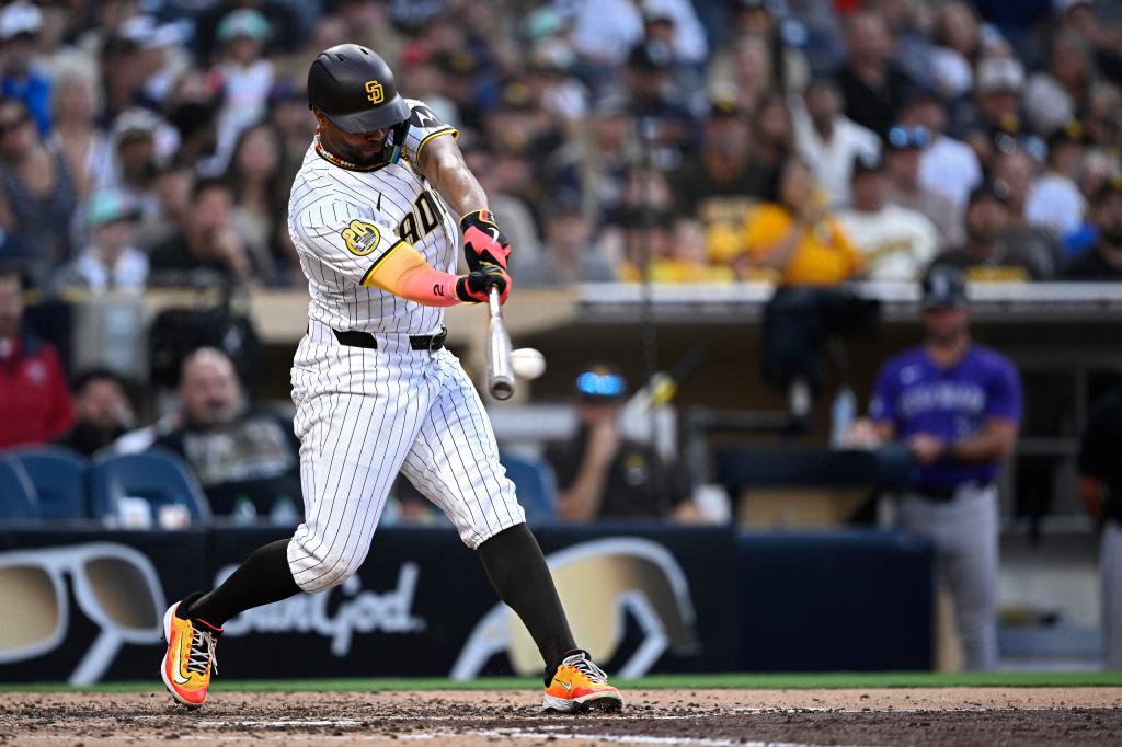 Xander Bogaerts #2 of the San Diego Padres hits an RBI single against the Colorado Rockies during the seventh inning at Petco Park on August 03, 2024 in San Diego, California. 