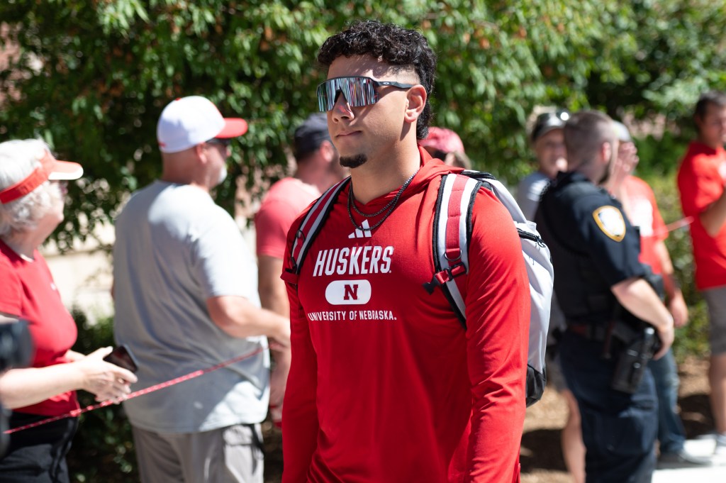 Dylan Raiola #15 of the Nebraska Cornhuskers leads the team to the stadium before the game against the UTEP Miners at Memorial Stadium on August 31, 2024 in Lincoln, Nebraska. 