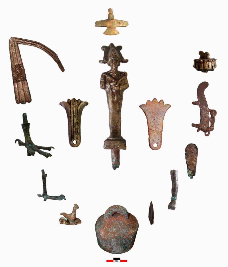 Treasures, tools, and statues like the god Osiris (middle) were also found.