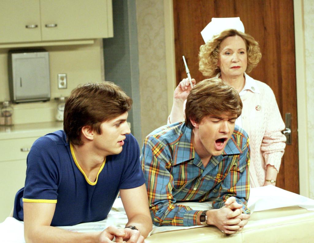 Ashton Kutcher, Topher Grace and Debra Jo Rupp in "That 70s Show." 