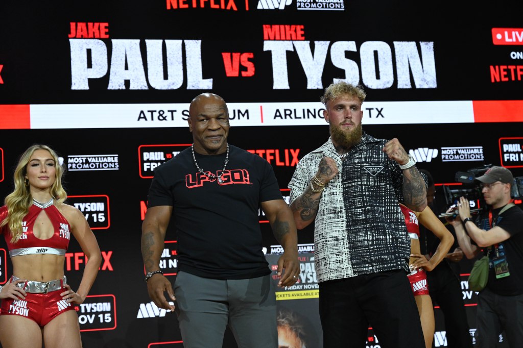 Mike Tyson and Jake Paul pose onstage during the Jake Paul vs. Mike Tyson Boxing match press conference at Fanatic Fest NYC.