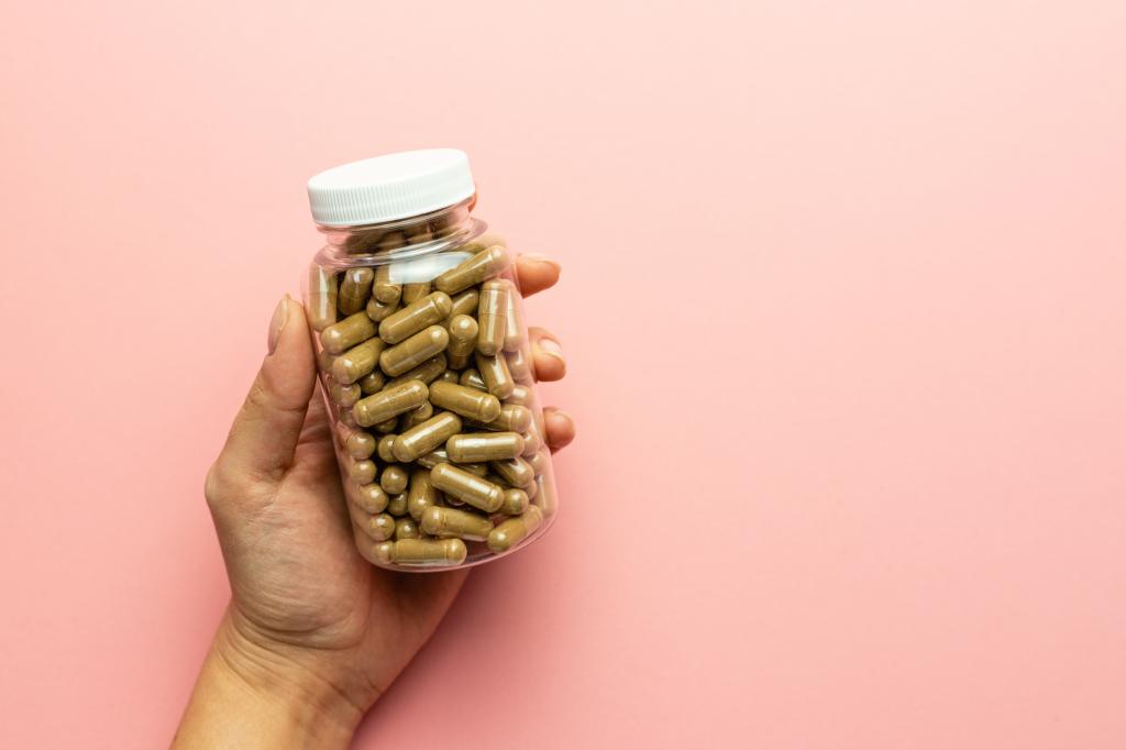 Hand holding a jar of ashwagandha capsules for immunity support and health care