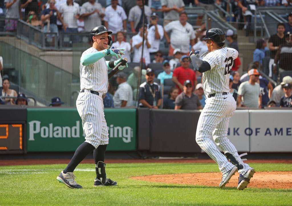 Juan Soto #22 of the New York Yankees celebrates with Aaron Judge #99 of the New York Yankees after he scores on his solo home run during the 7th inning when the New York Yankees played the Colorado Rockies Sunday, August 25, 2024 at Yankee Stadium in the Bronx, NY. 