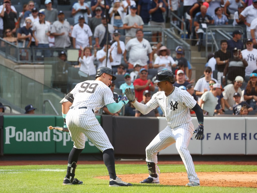 Juan Soto #22 of the New York Yankees celebrates with Aaron Judge #99 of the New York Yankees after he scores on his solo home run during the 7th inning when the New York Yankees played the Colorado Rockies Sunday, August 25, 2024 at Yankee Stadium in the Bronx, NY.