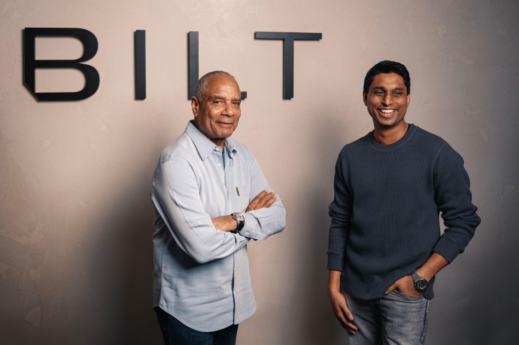 Ken Chenault and Ankur Jain post for a photo.