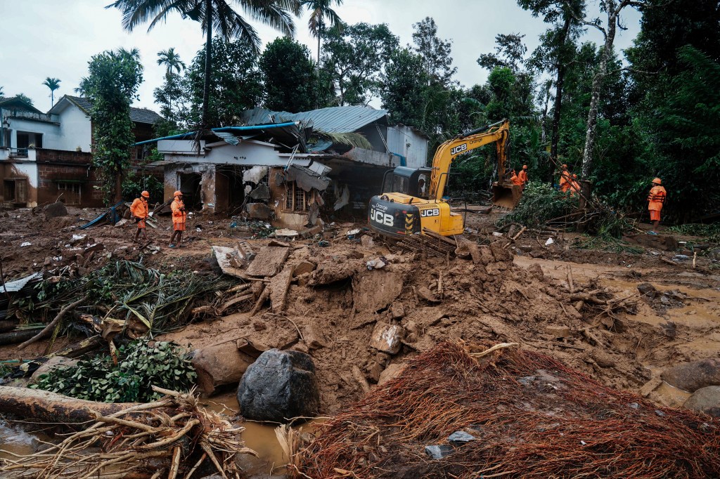 Rescuers search through mud and debris for a third day after landslides set off by torrential rains in Wayanad district, Kerala state, India, on Aug. 1, 2024. 