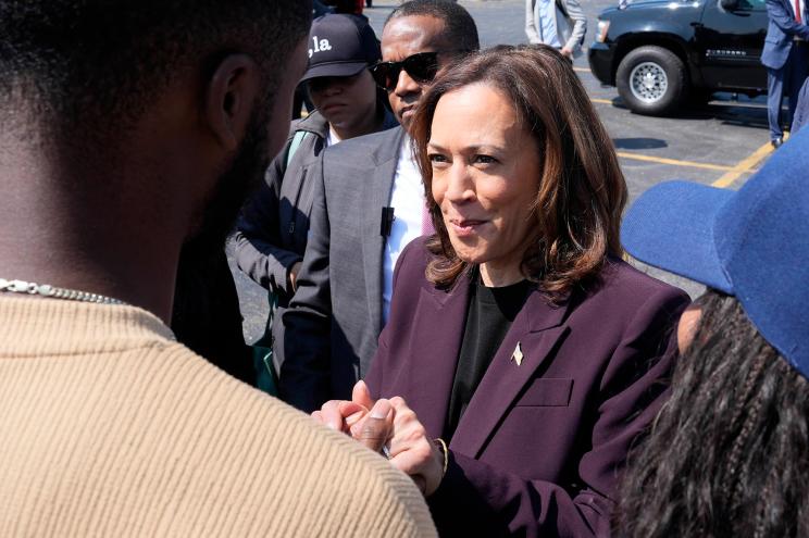 Democratic presidential nominee Vice President Kamala Harris greets supporters before boarding Marine Two at Soldier Field in Chicago, Friday, Aug. 23, 2024.