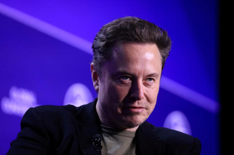 Elon Musk, Chief Executive Officer of SpaceX and Tesla and owner of X looks on during the Milken Conference 2024 Global Conference Sessions at The Beverly Hilton in Beverly Hills, California.