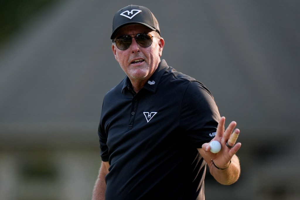 Phil Mickelson waves after making a putt on the ninth hole during the second round of the U.S. Open golf tournament Friday, June 14, 2024, in Pinehurst, N.C.