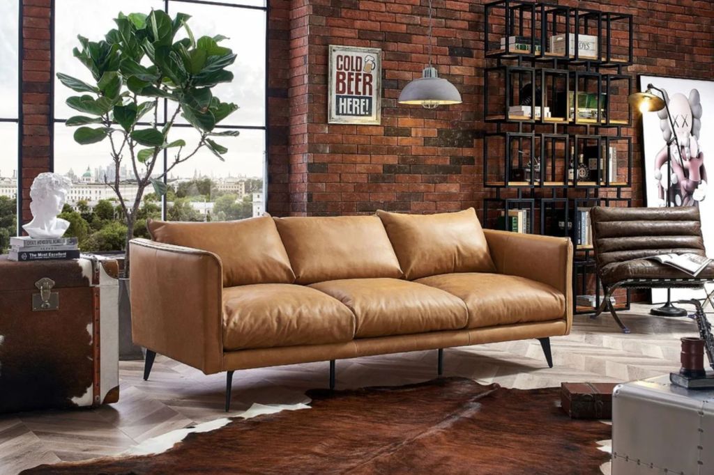 A real leather couch in a mid-century modern styled living.