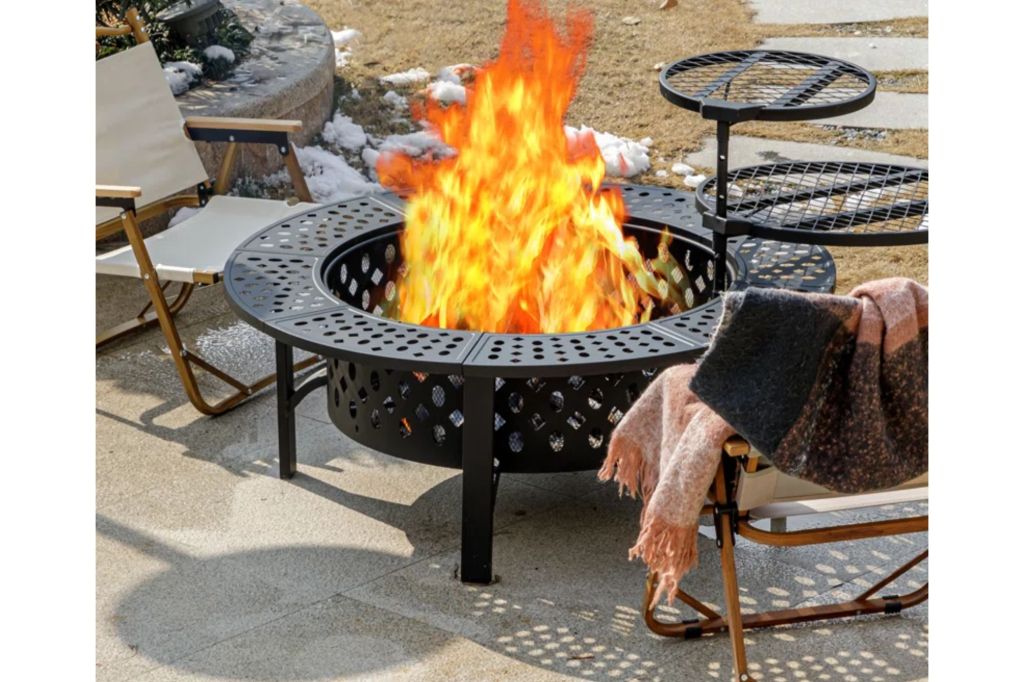 A fire pit with a fire roaring.