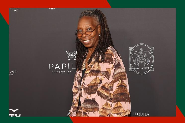 Whoopi Goldberg smiles on the red carpet.