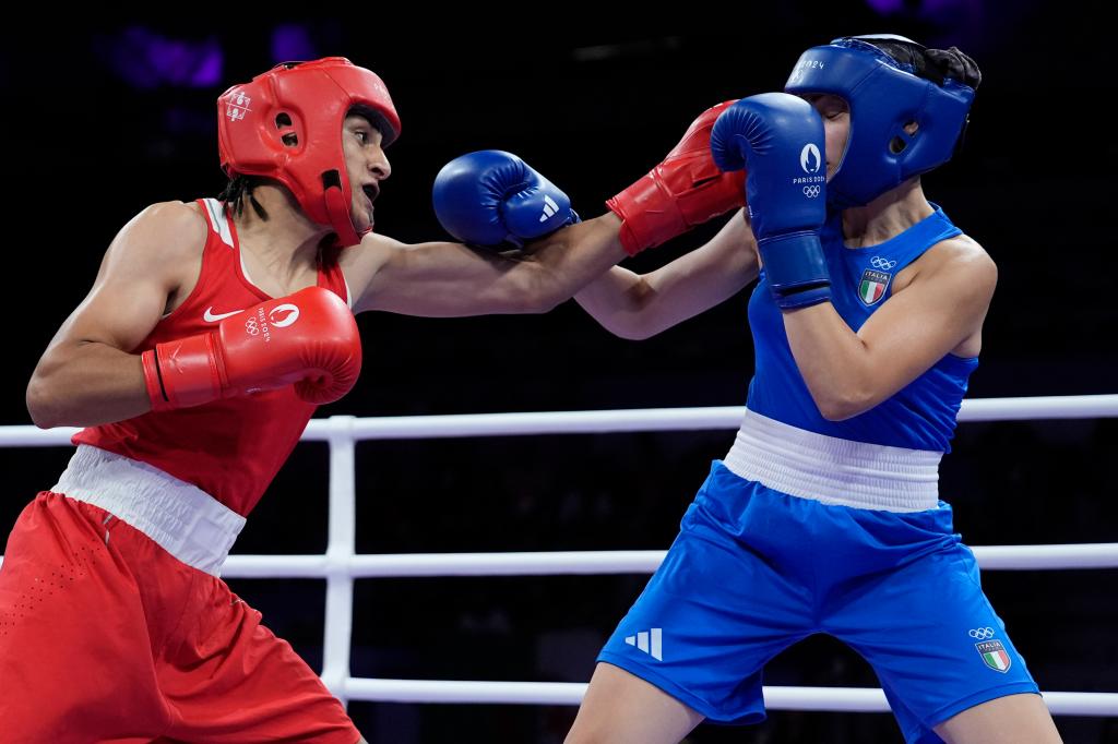 Algeria's Imane Khelif, left, fights Italy's Angela Carini in their women's 66kg preliminary boxing match at the 2024 Summer Olympics, Thursday, Aug. 1, 2024,