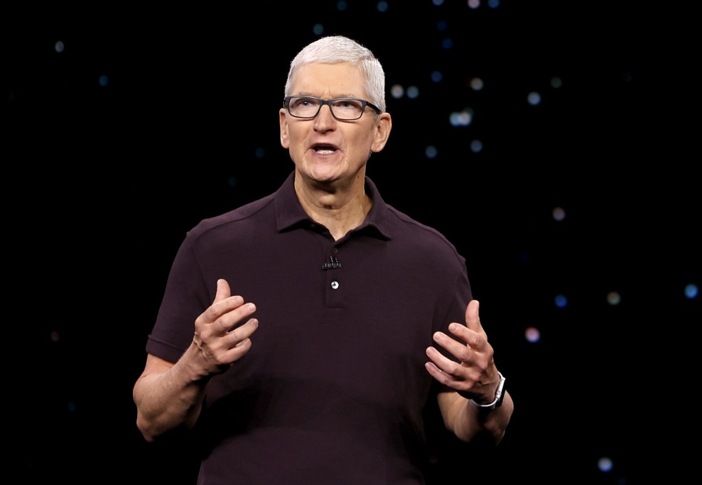 Apple is laying off around 100 workers from its digital services department, according to a report. Apple CEO Tim Cook is pictured above.