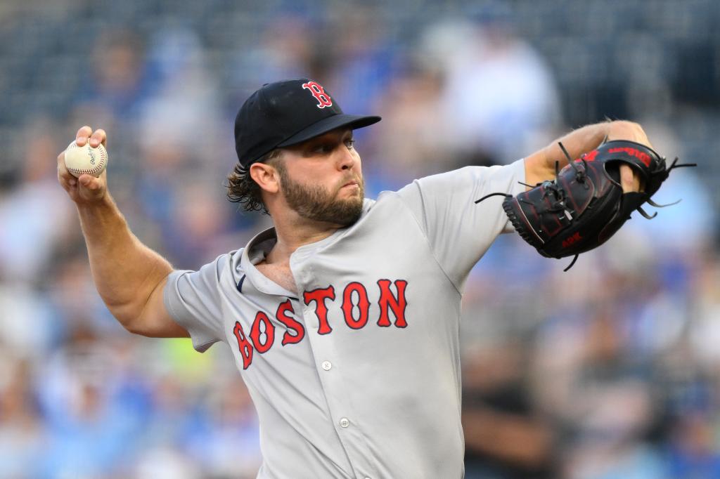 Boston Red Sox starting pitcher Kutter Crawford throws to a Kansas City Royals batter during the first inning of a baseball game, Wednesday, Aug. 7, 2024, in Kansas City, Mo.