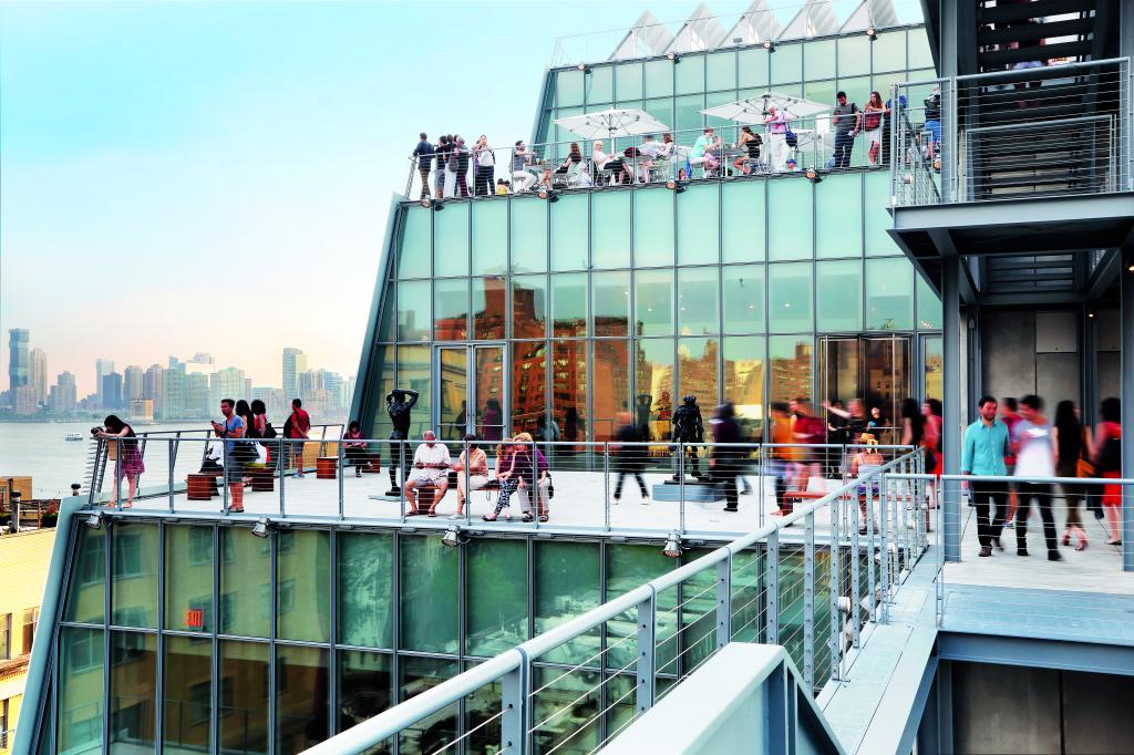 Upper exterior of Whitney Museum with people. 