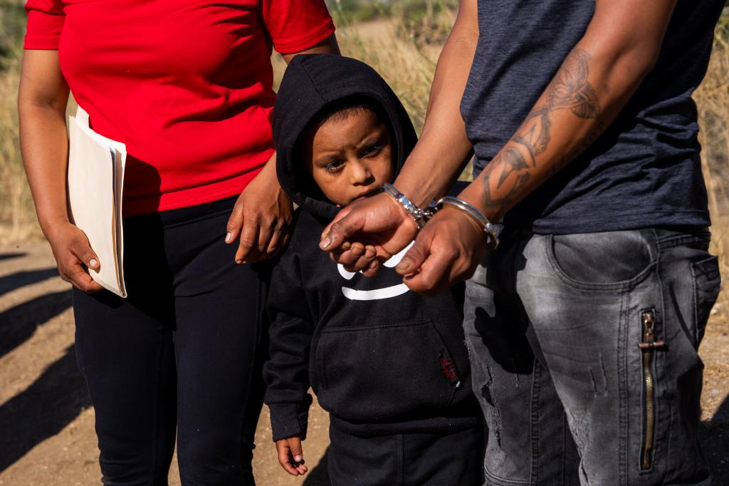 A migrant child is seen after crossing the border in Jacumba Hot Springs, California.
