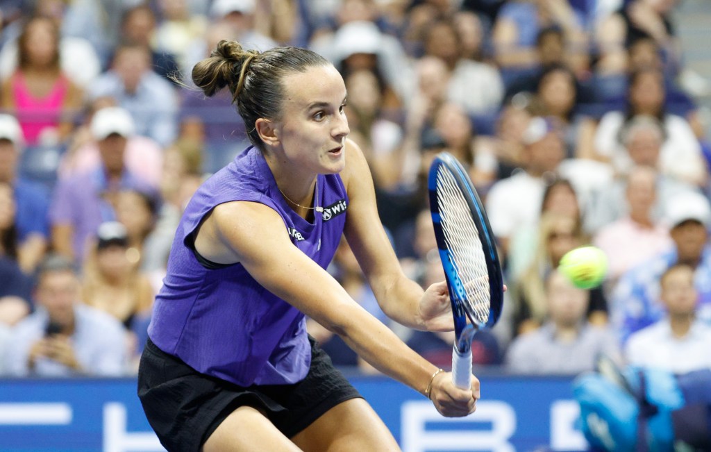 Clara Burel of France returns a volley against Sloane Stephens on Aug. 26, 2024.