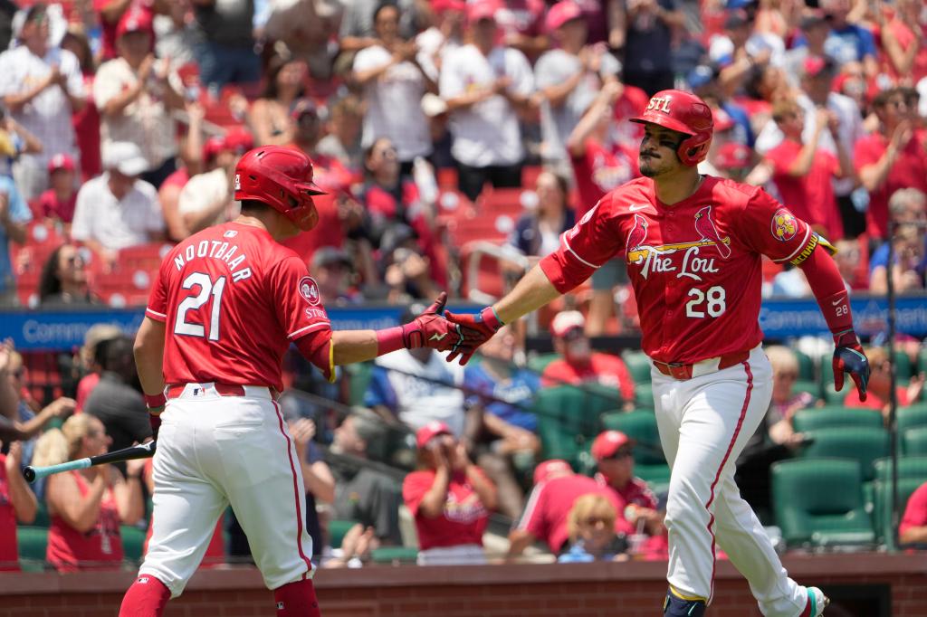 St. Louis Cardinals' Nolan Arenado (28) is congratulated by teammate Lars Nootbaar (21) after hitting a solo home run during the second inning in the first game of a baseball doubleheader against the Kansas City Royals Wednesday, July 10, 2024.