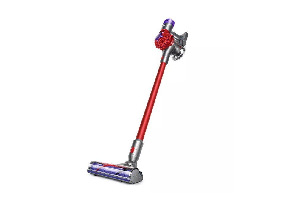 A vacuum cleaner with a red handle