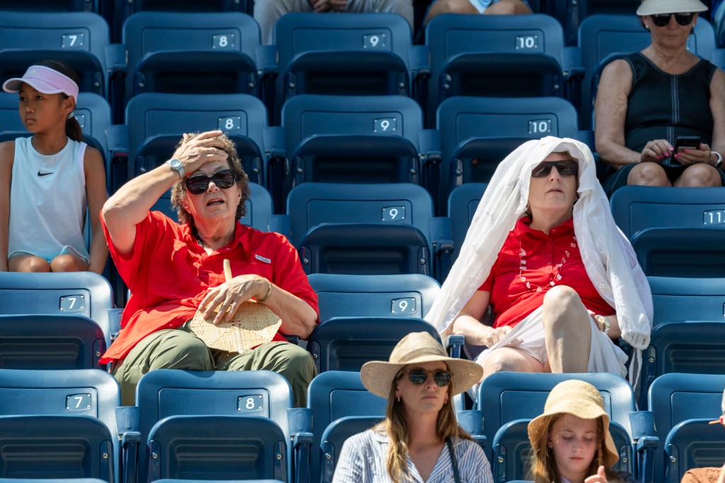 Spectators at the US Open in Queens kept cool under towels on Tuesday.